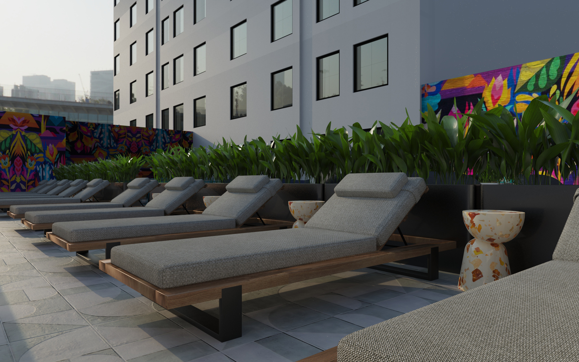 Rooftop terrace at 212 W 124th St, Harlem - grey lounge seating with a color mural feature wall.