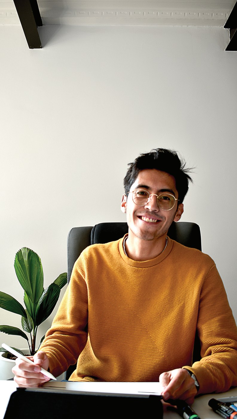 Julian Acero Rodriguez, 3D visualization artist at Sky Up Design, at his desk in the studio.