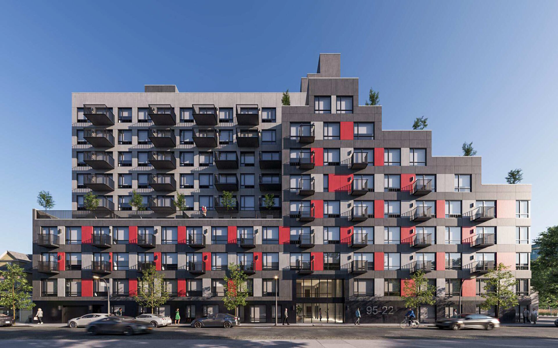 95-22 147th Pl, Jamaica, Queens - modern multi-family building with grey facade and red balcony accents.
